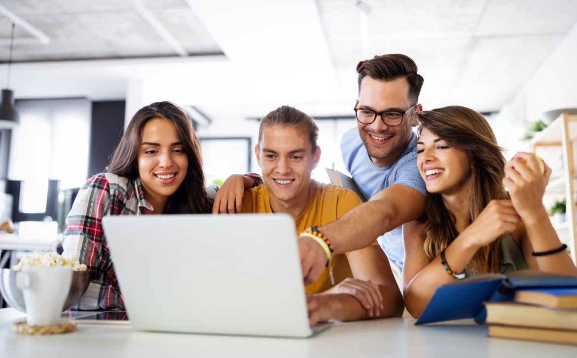 multiracial-young-people-enjoying-group-study-at-table-picture-id1276383007